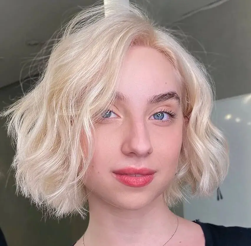 Textured Blunt Bob: Volumizing Haircut with Side Part