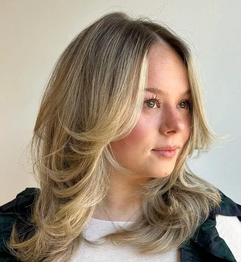 Medium Locks, Soft Flips: Volumizing Haircut Delight