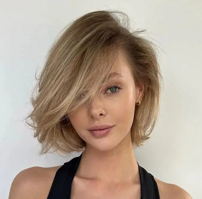 Subtle Layers, Maximum Volume: Side-Swept Bob Styling