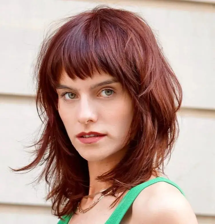 Fiery Shag Magic: Volumizing Haircuts with Short Fringe