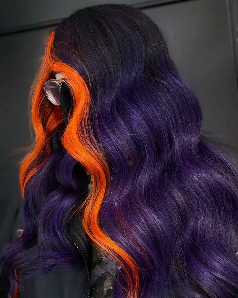 Bold Contrasts: Purple Balayage with Orange Money Pieces