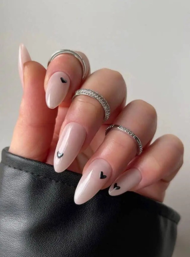Valentine’s Day Nails | Milky White Nails Adorned with Black Hearts - Subtle Elegance