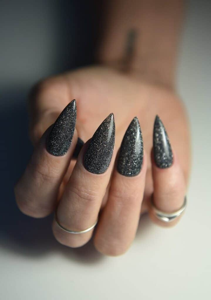 Black Christmas Nail Ideas: Sparkly Stiletto Nails