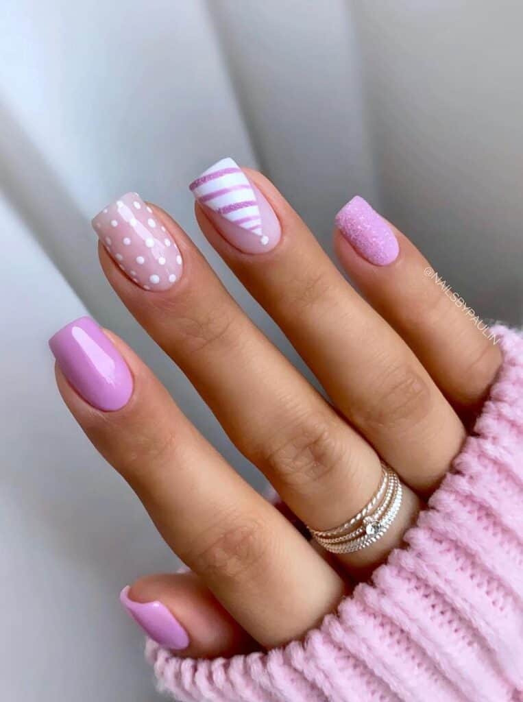 Pink Nails with Dot Details and Striped Santa Hat Art