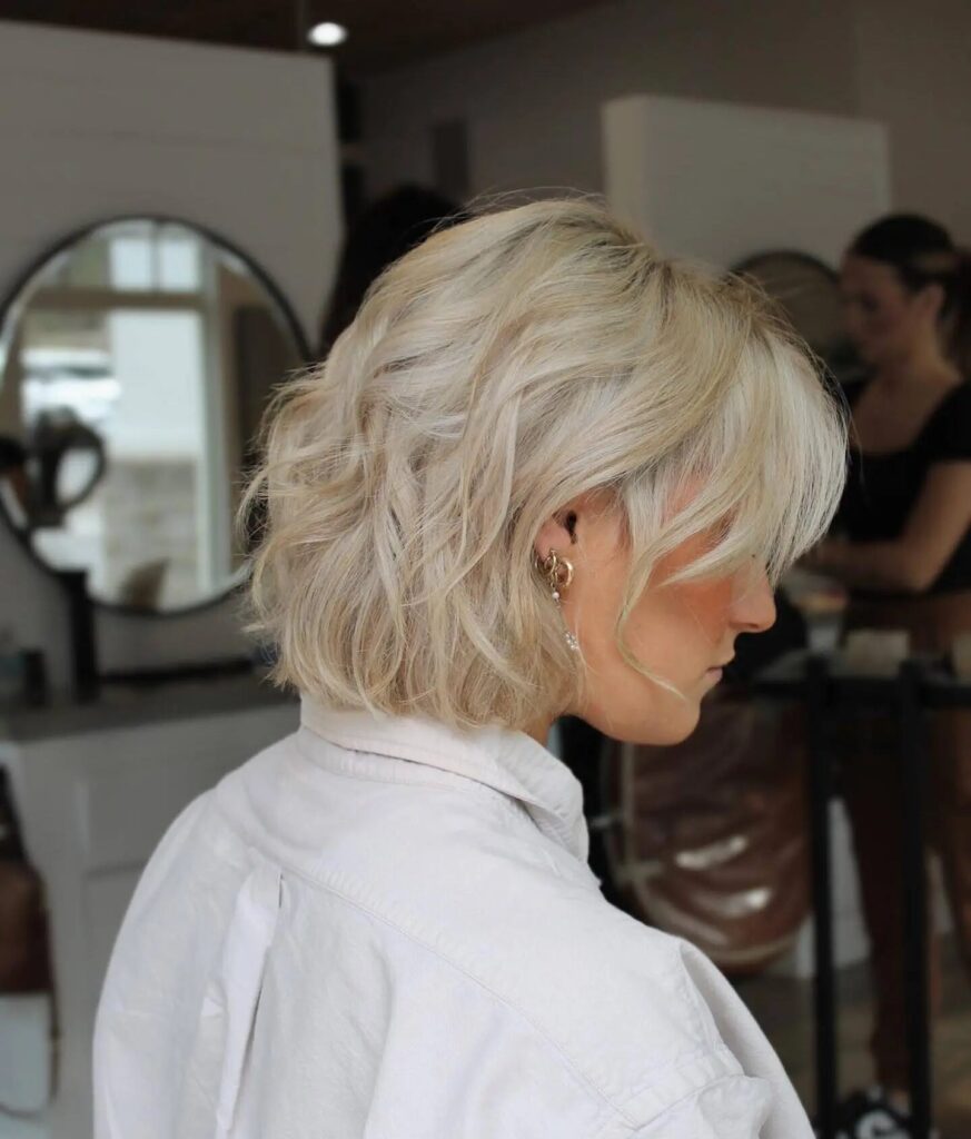 Elevate Your Style with an Elegant Blonde Bob Tailored for Wavy Hair