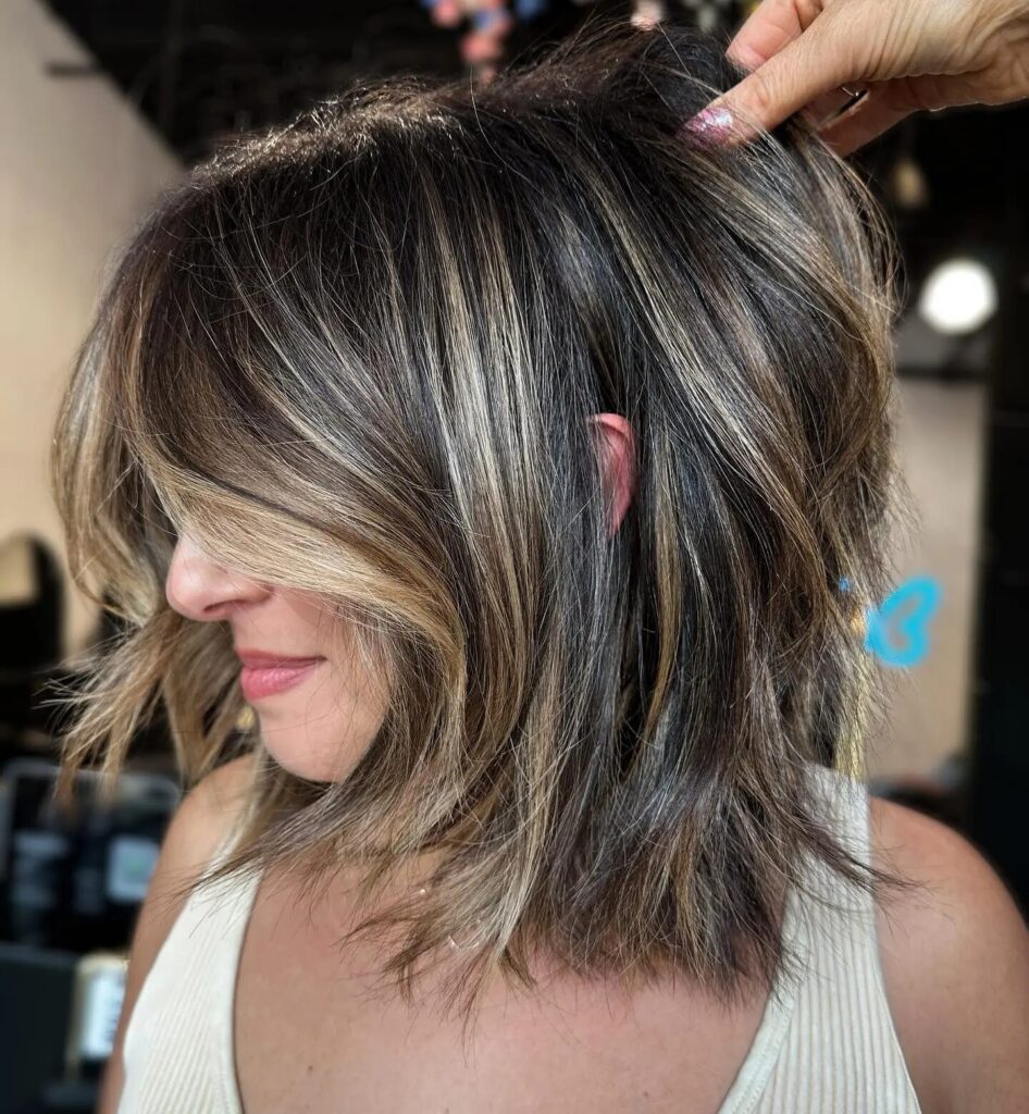 Get Noticed with a Thick Layered Bob Featuring Framing Highlights