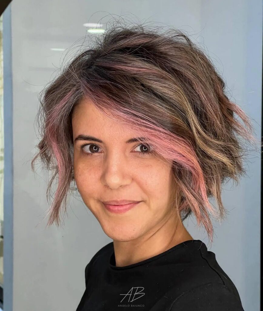 Trendy and Playful: Choppy Stacked Bob with Pink Money Pieces