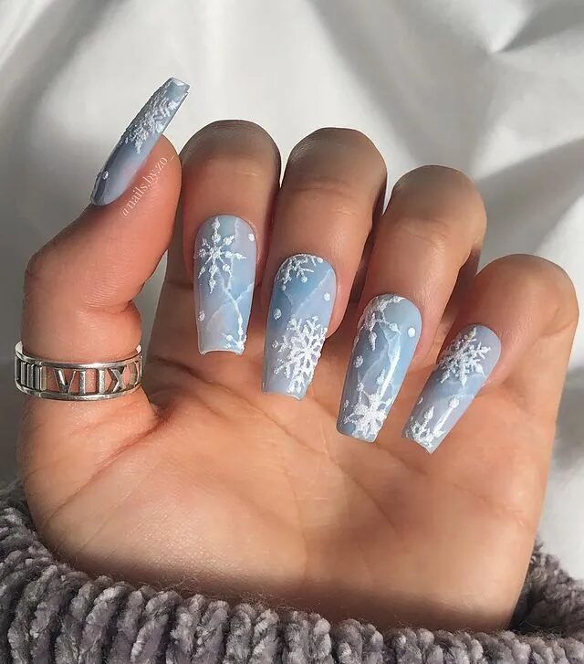 Winter Nail Designs | Blue Marbled Nails Paired with Artistic Snowflake Designs