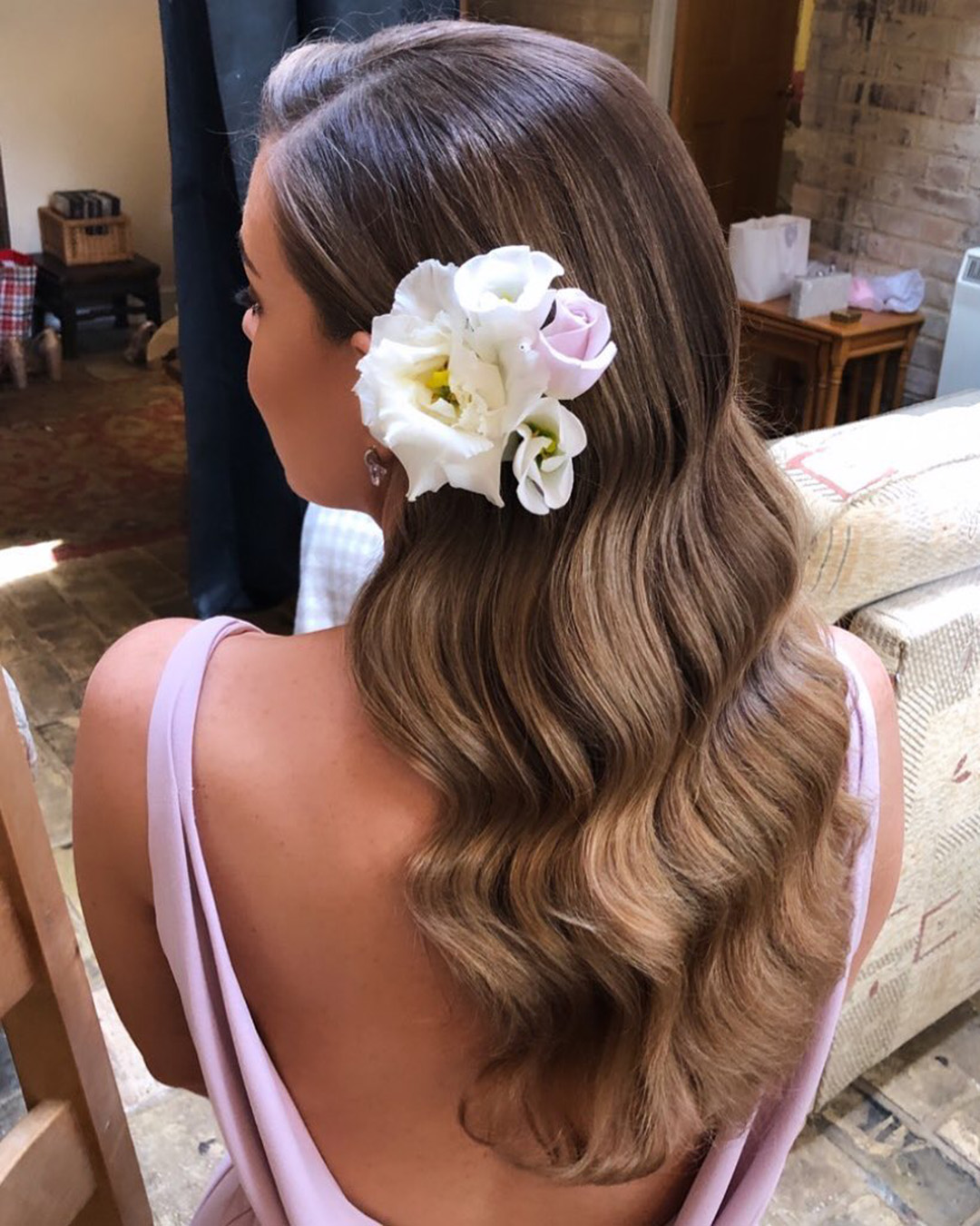 rustic wedding hairstyles wavy hair down with flower botiashairandmakeup