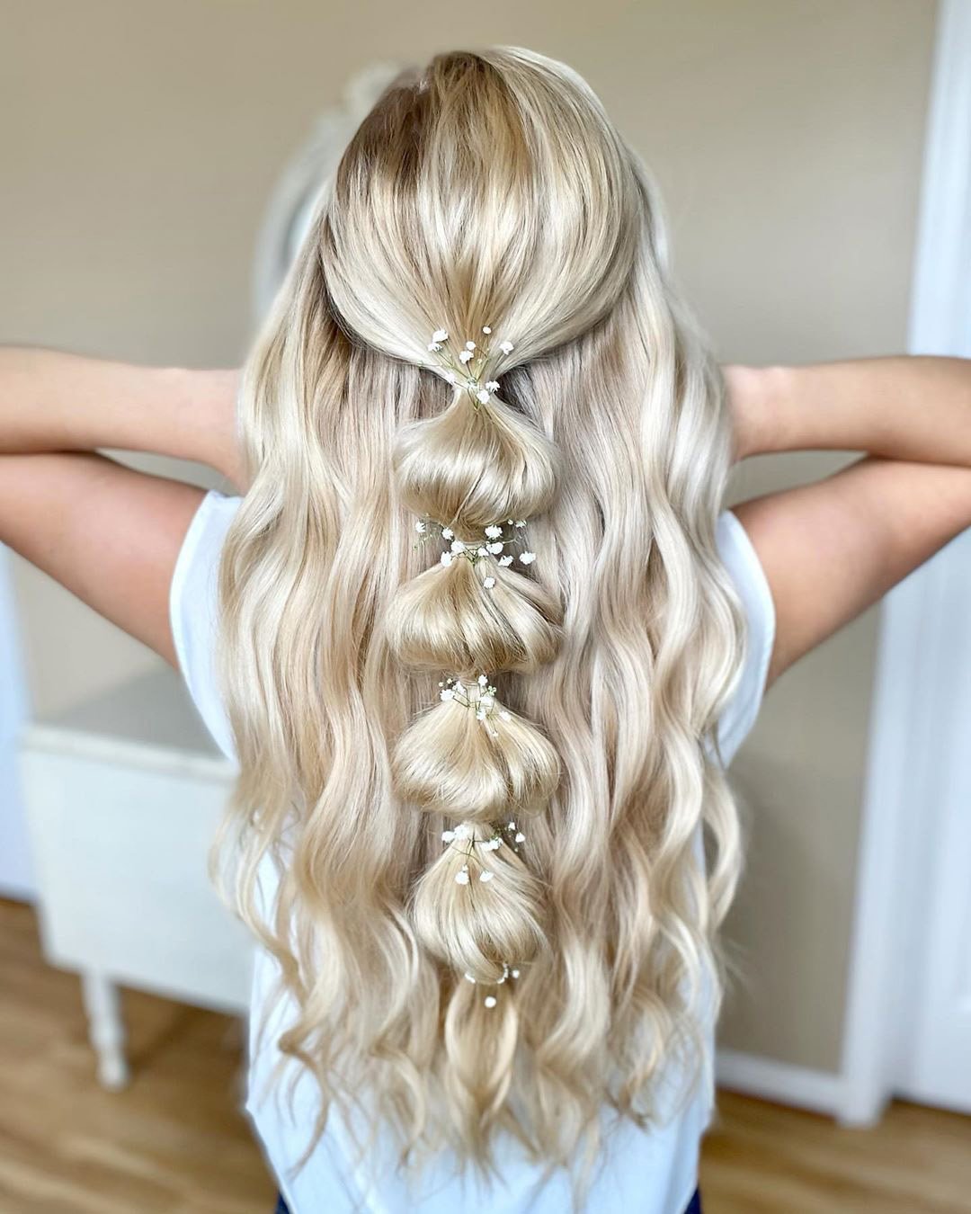 rustic wedding hairstyles half up blonde curls with baby breath theupdodarling