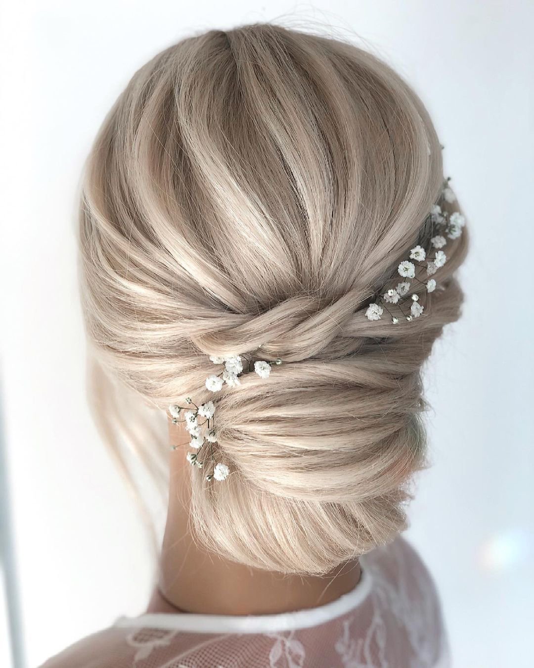 rustic wedding hairstyles textured chignon with baby breath reneemarieacademy