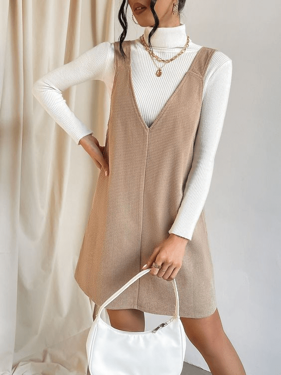 V-Neck Pinafore Dress Paired with Ribbed Turtleneck and Gold Accessories