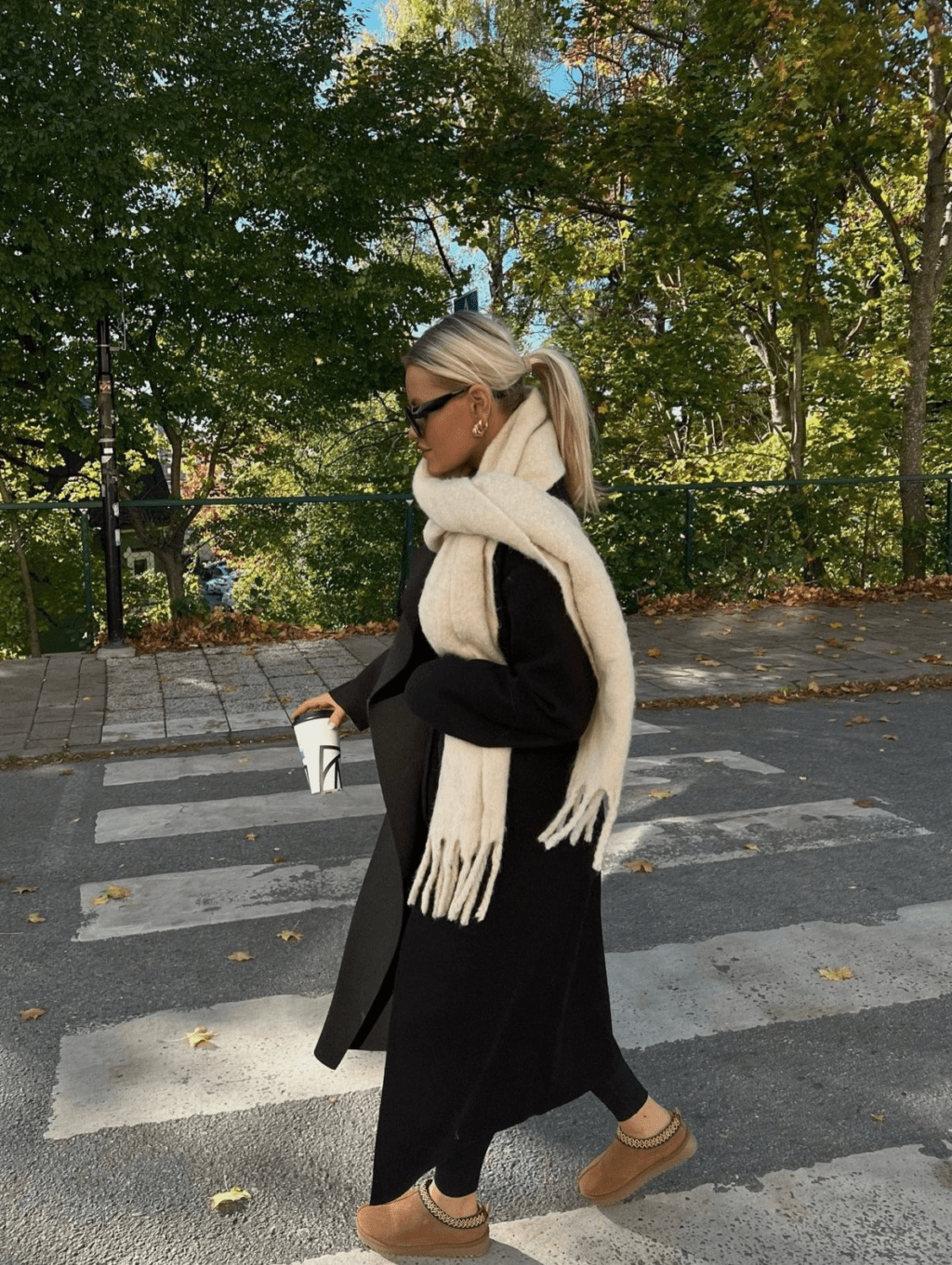 black wool coat and a thick, ivory scarf are your go-to combo for a chic winter weekend look. 